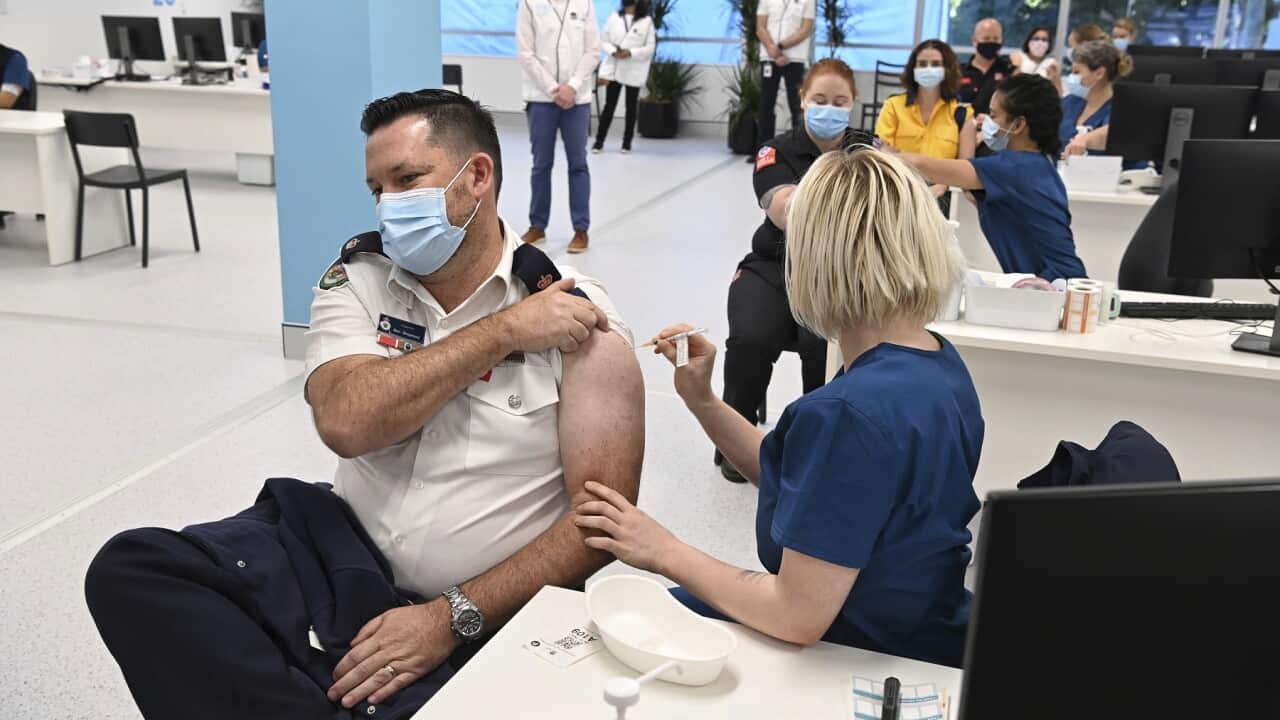 A Pfizer vaccine is administered at the COVID-19 Vaccination Centre in Sydney