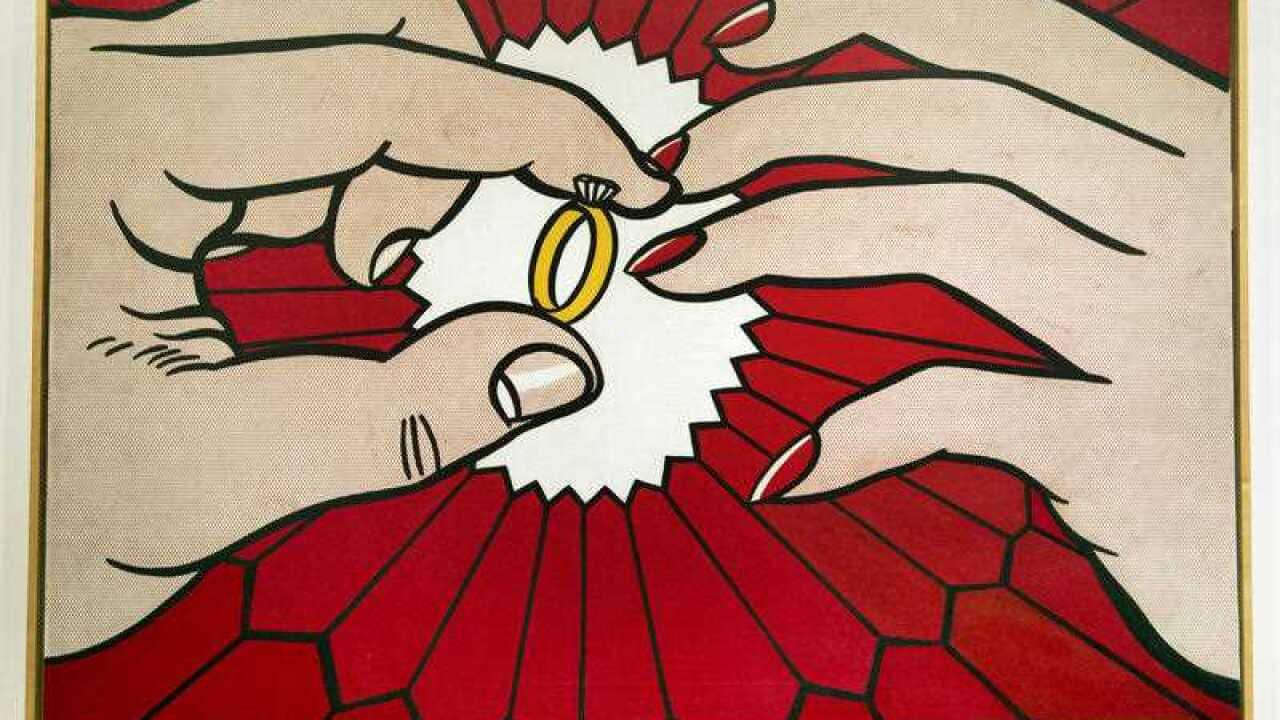 The Ring (Engagement), a 1962 oil on canvas, by the late artist Roy Lichtenstein, is displayed during the preview of Lichtenstein's first major exhibition since his death, Tuesday, Oct. 9, 2012, at the National Gallery of Art in Washington. (AP Photo/Manu