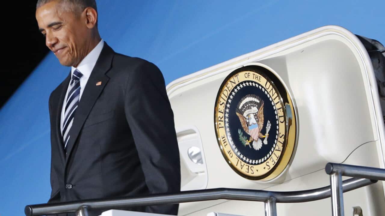 President Barack Obama steps off Air Force One