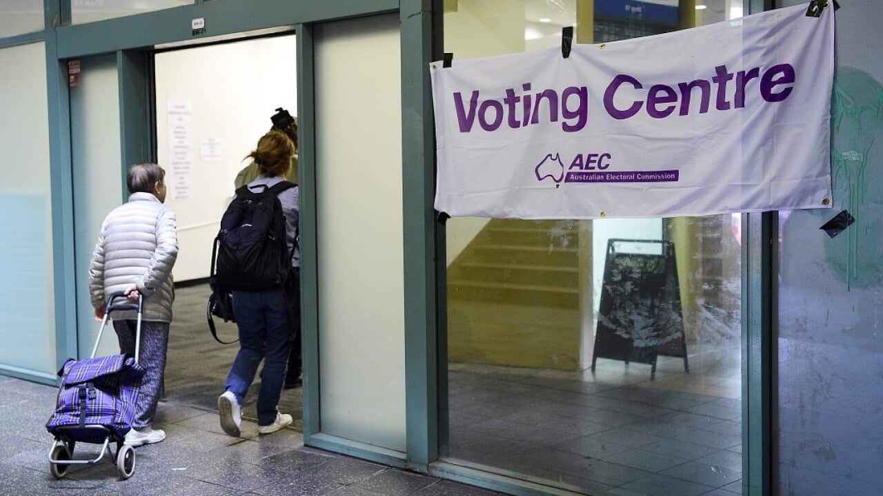 Voters are seen entering a pre-polling booth at Central Station, Sydney, Monday, April 29, 2019.
