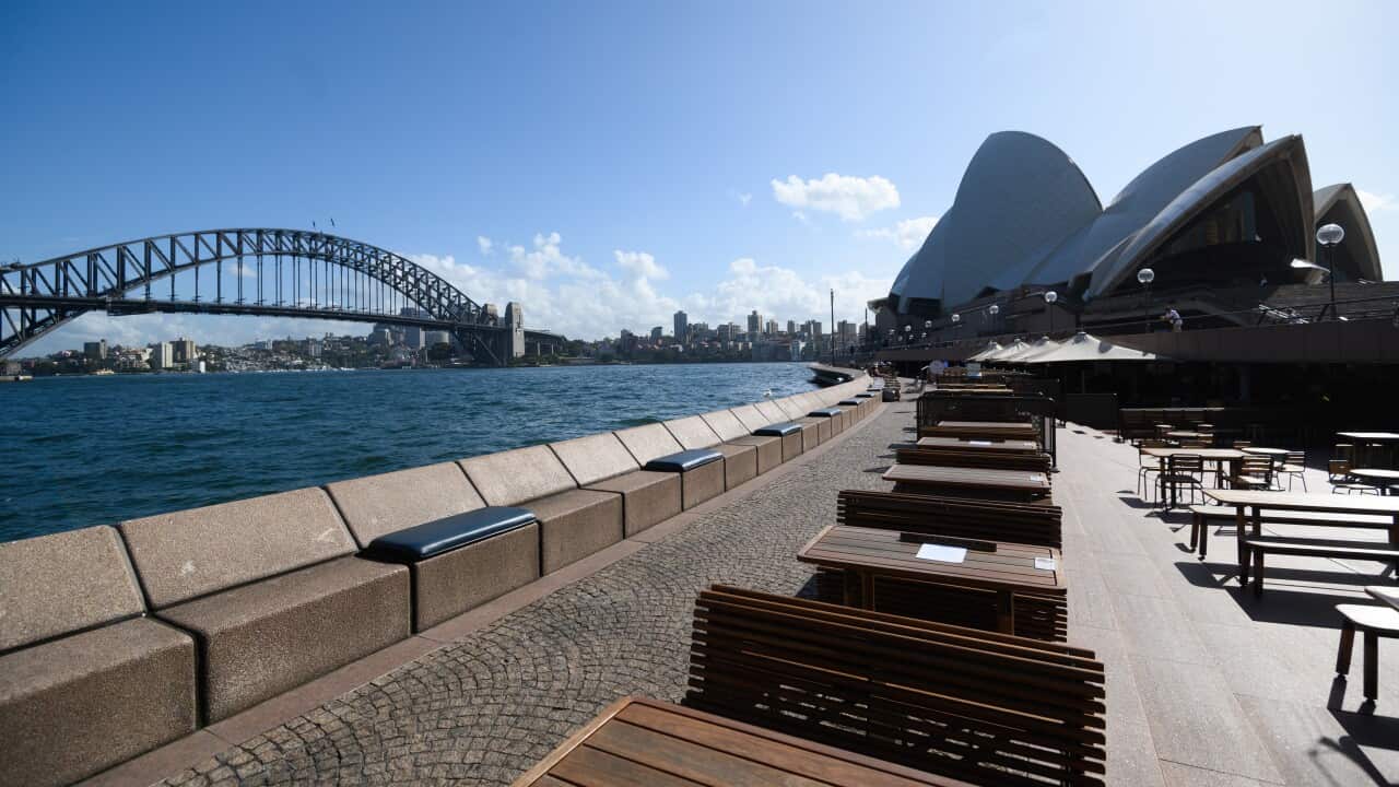 Empty tables at the Sydney's Opera Bar restaurant, Sydney on Saturday.
