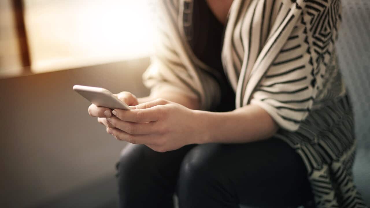 Close up of woman with smartphone