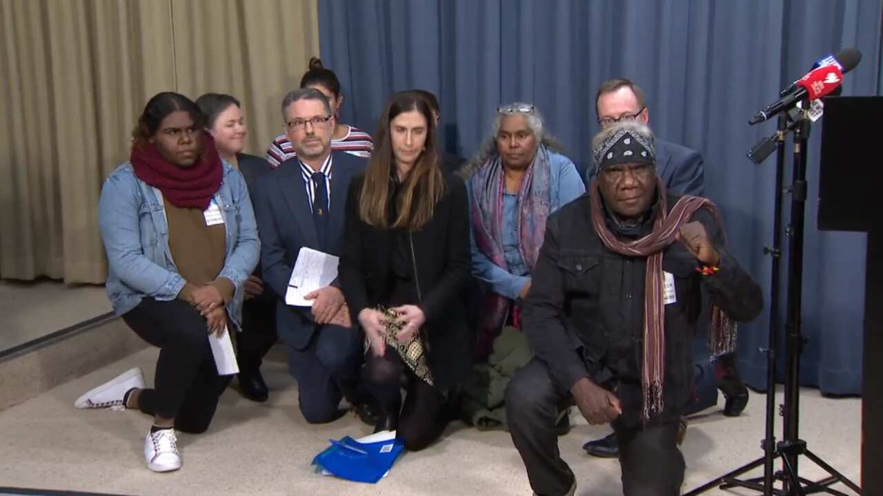 The family of the aboriginal teenager who was slammed to the ground by the police in Sydney takes a knee to protest aginst police crulety.