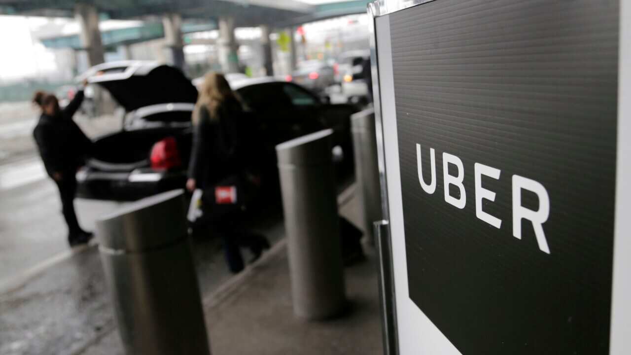 A sign marks a pick-up point for the Uber car service at LaGuardia Airport in New York.