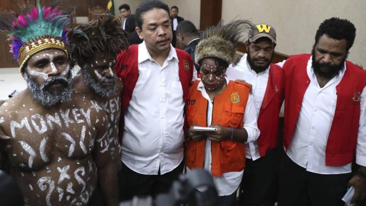 Papuan independence activists, from left to right, Anes Tabuni, Ambrosius Mulait, Suryanta Ginting, Arina Elopere, Isay Wenda, and Charles Kossay attend their trial at Central Jakarta District Court, Dec 19, 2019.