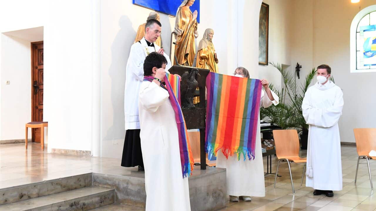 Rainbow flags are raised in St. Benedict Church in Munich during a Catholic service with the blessing of homosexual couples as part of a nationwide campaign.