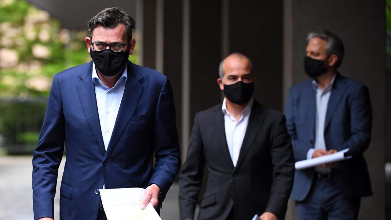 Victorian Premier Daniel Andrews (left) arrives at a press conference in Melbourne, on Tuesday 13 October.