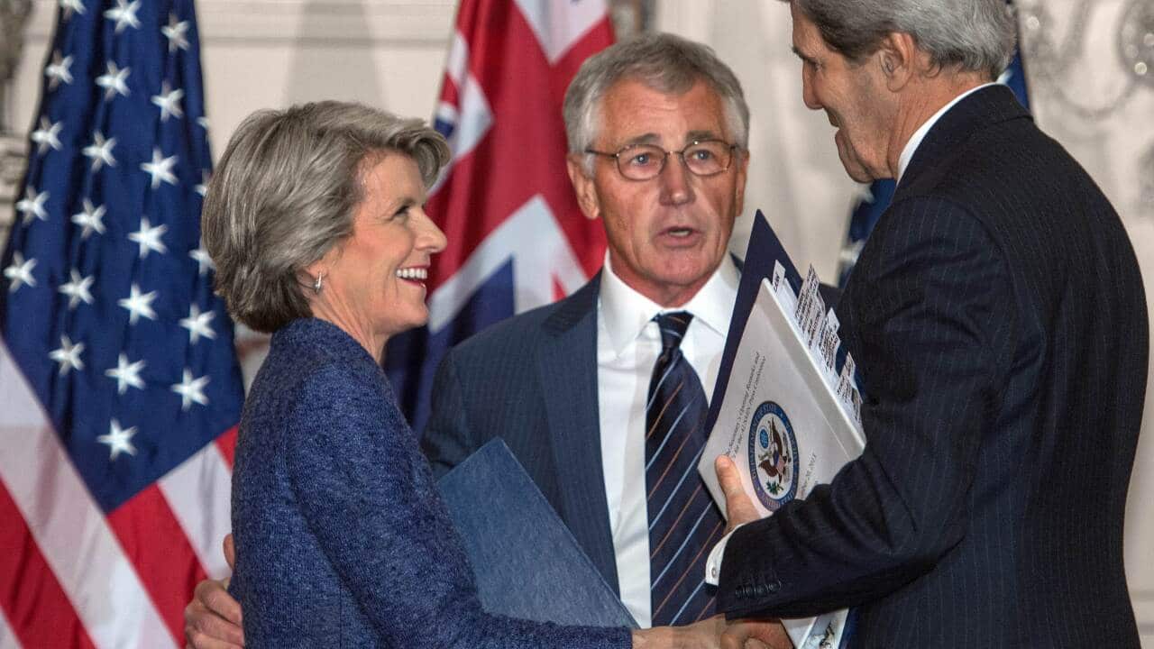Foreign Minister Julie Bishop shakes hands with US Secretary of State John Kerry before US Secretary of Defense Chuck Hagel in Washington