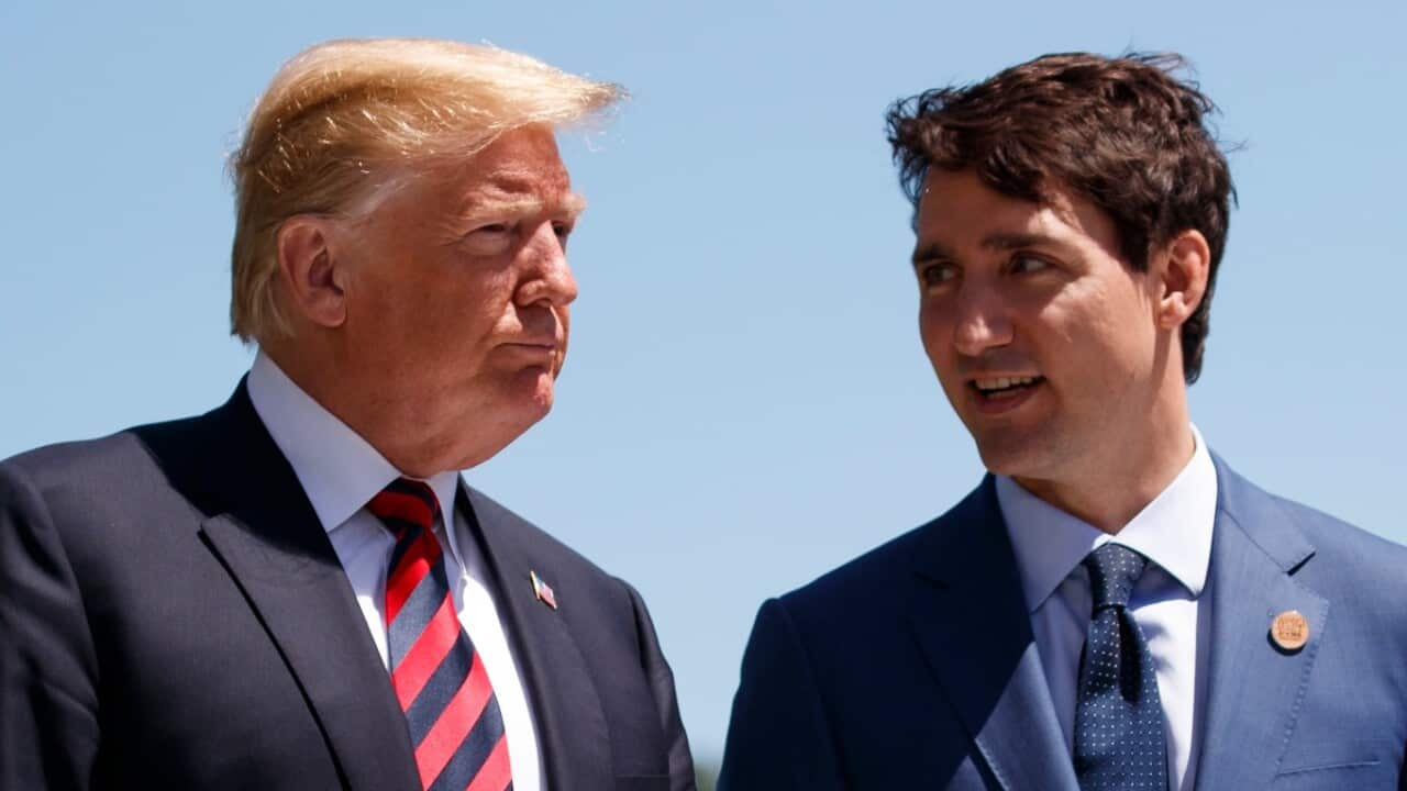 President Donald Trump talks with Canadian Prime Minister Justin Trudeau during a G-7 Summit welcome ceremony
