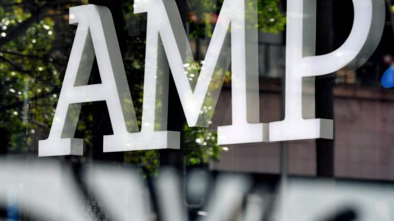 AMP Bank signage is seen through glass.