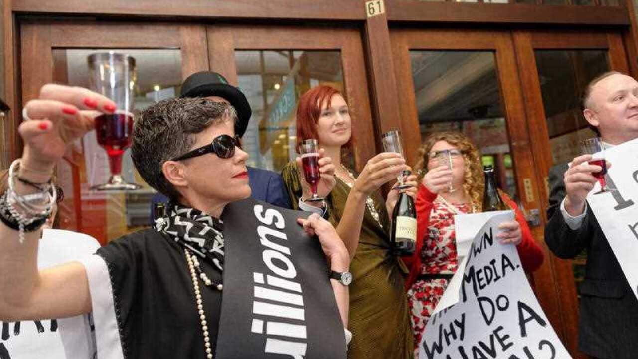 Union protesters dressed as millionaires rallied against the impact on workers of cuts to penalty rates outside a Productivity Commission hearing into workplace relations in Sydney on September 17, 2015.