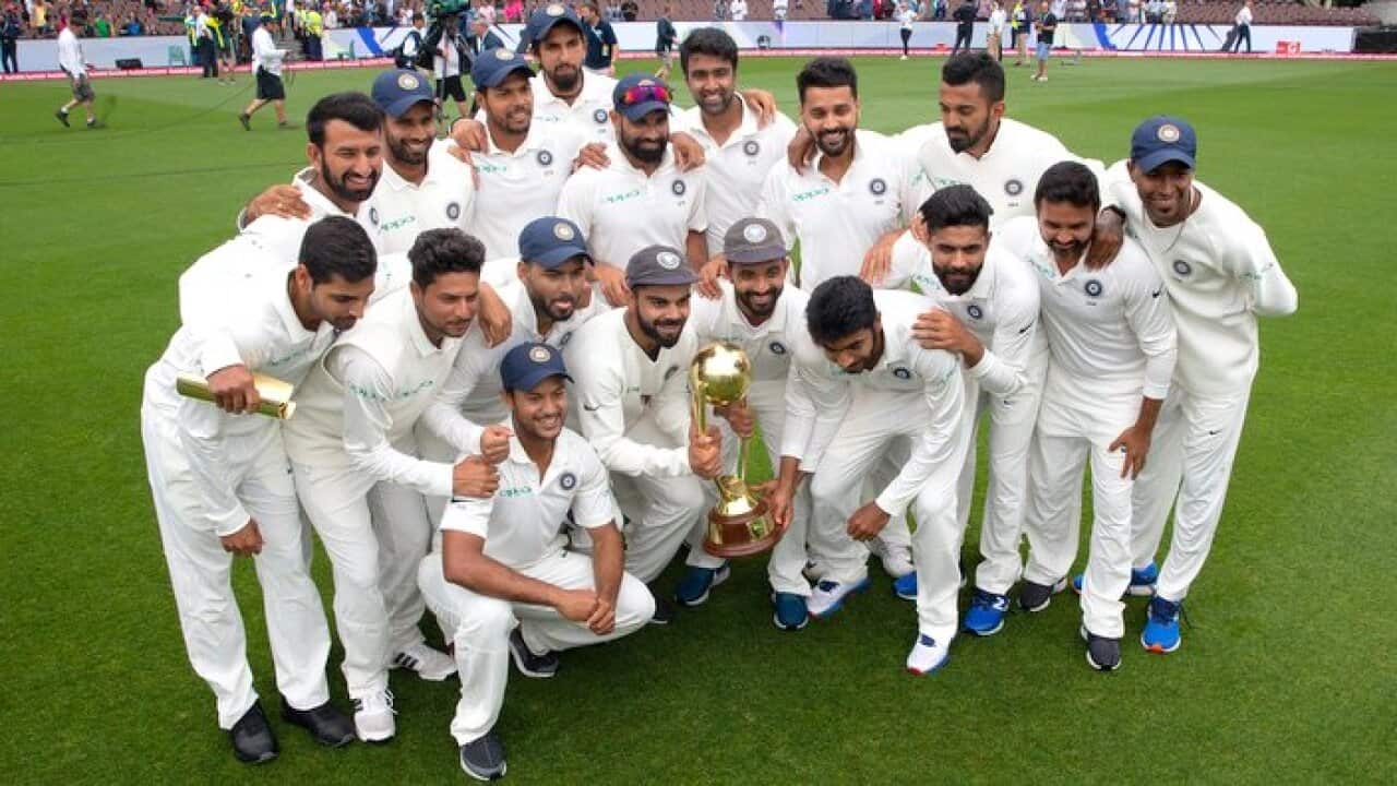 Indian players hold up the Border/Gavaskar trophy on day five of the Fourth Test match between Australia and India at the SCG in Sydney.