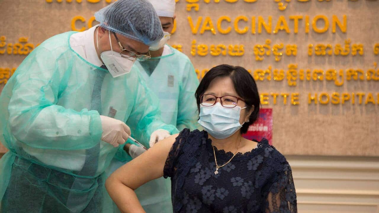 Cambodia Ministry of Health spokeswoman Or Vandinn receives her Covid vaccination