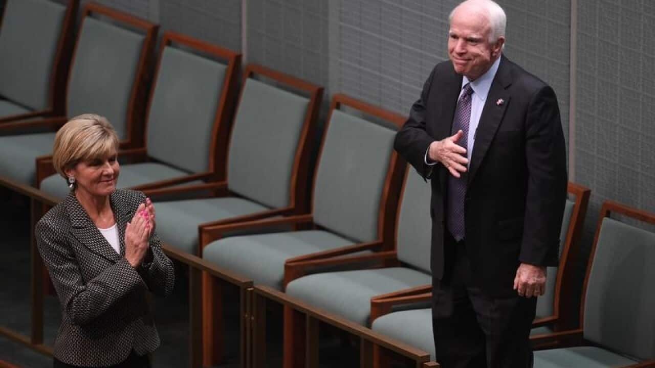 John McCain and Julie Bishop in the Australian Parliament.