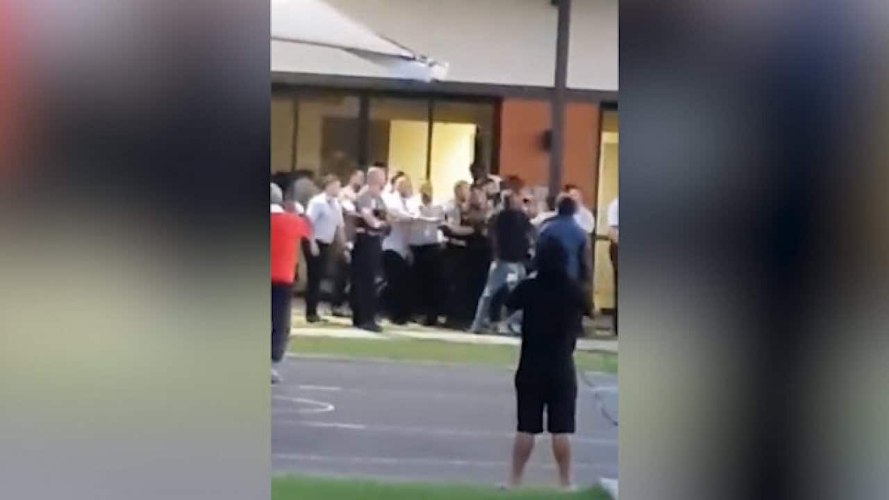 A confrontation between detainees and officers at Villawood detention centre.