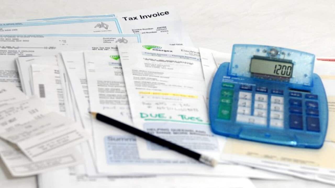 A stock image of house bills and a calculator in Brisbane, June 4, 2007. (AAP Image/Maria Zsoldos)