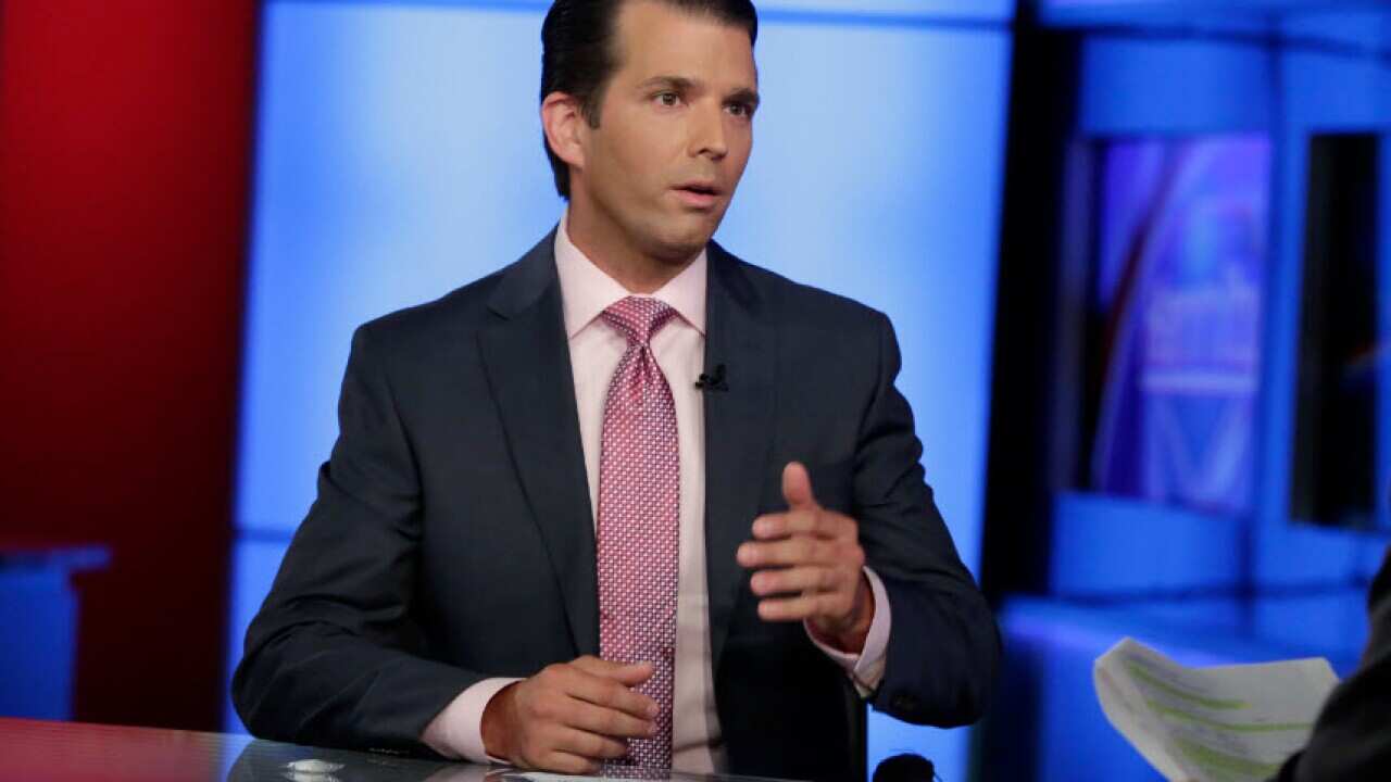 In this photo taken July 11, 2017, Donald Trump Jr. is interviewed by host Sean Hannity on his Fox News Channel television program