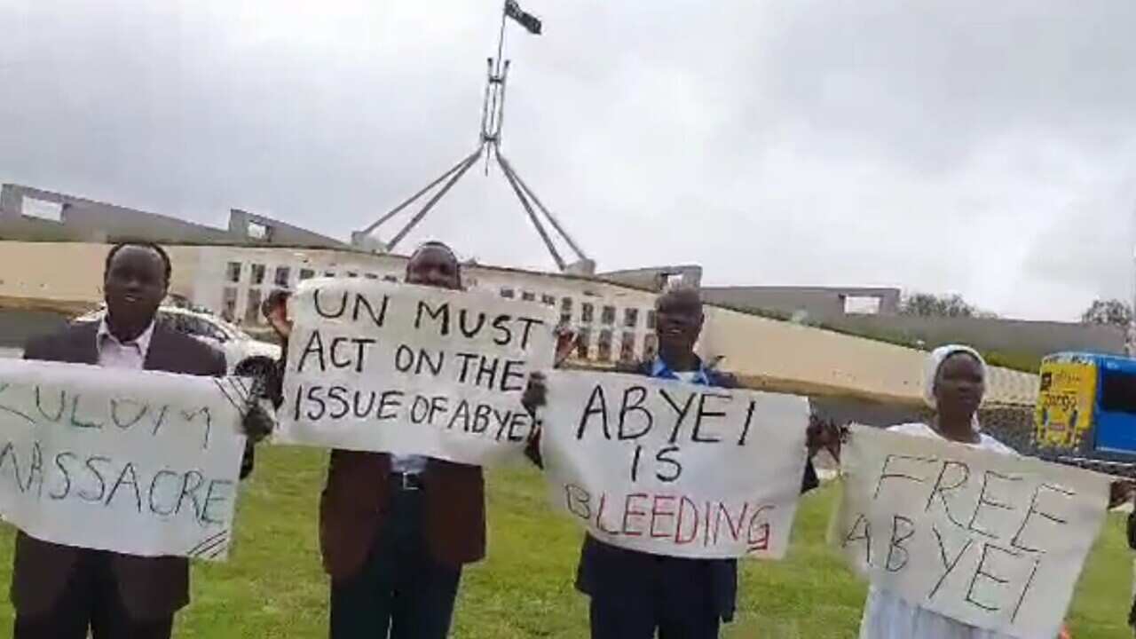 Members of Abyei Community in standing outside Australian Parliament