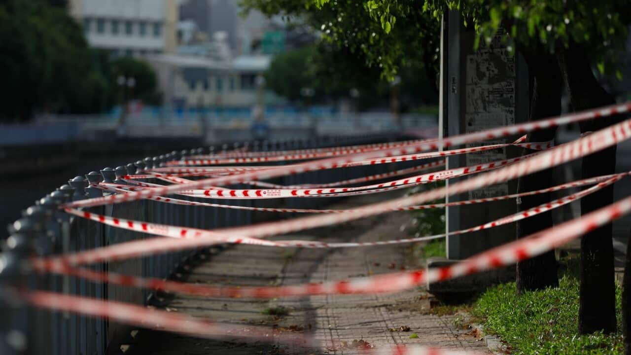 A sidewalk is cordoned off in Ho Chi Minh City, Vietnam, Monday, July 26, 2021.