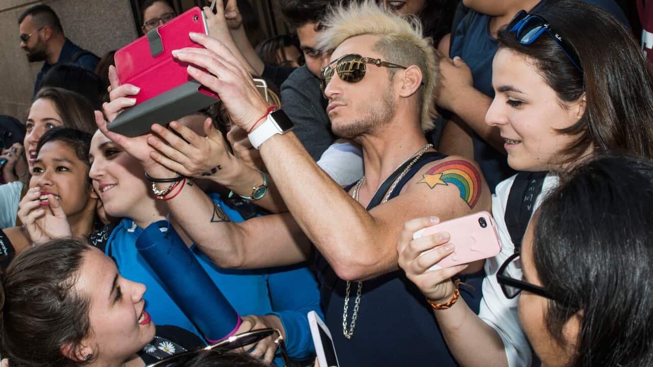 Ariana Grande's brother, Frankie J. Grande, is mobbed by fans in Milan, Italy. (AAP/Alberto Scarpinato)