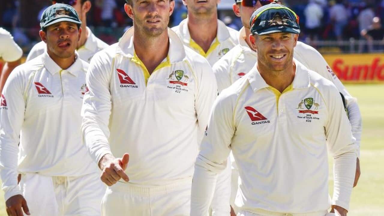 David Warner leads his team off after losing the second cricket test.