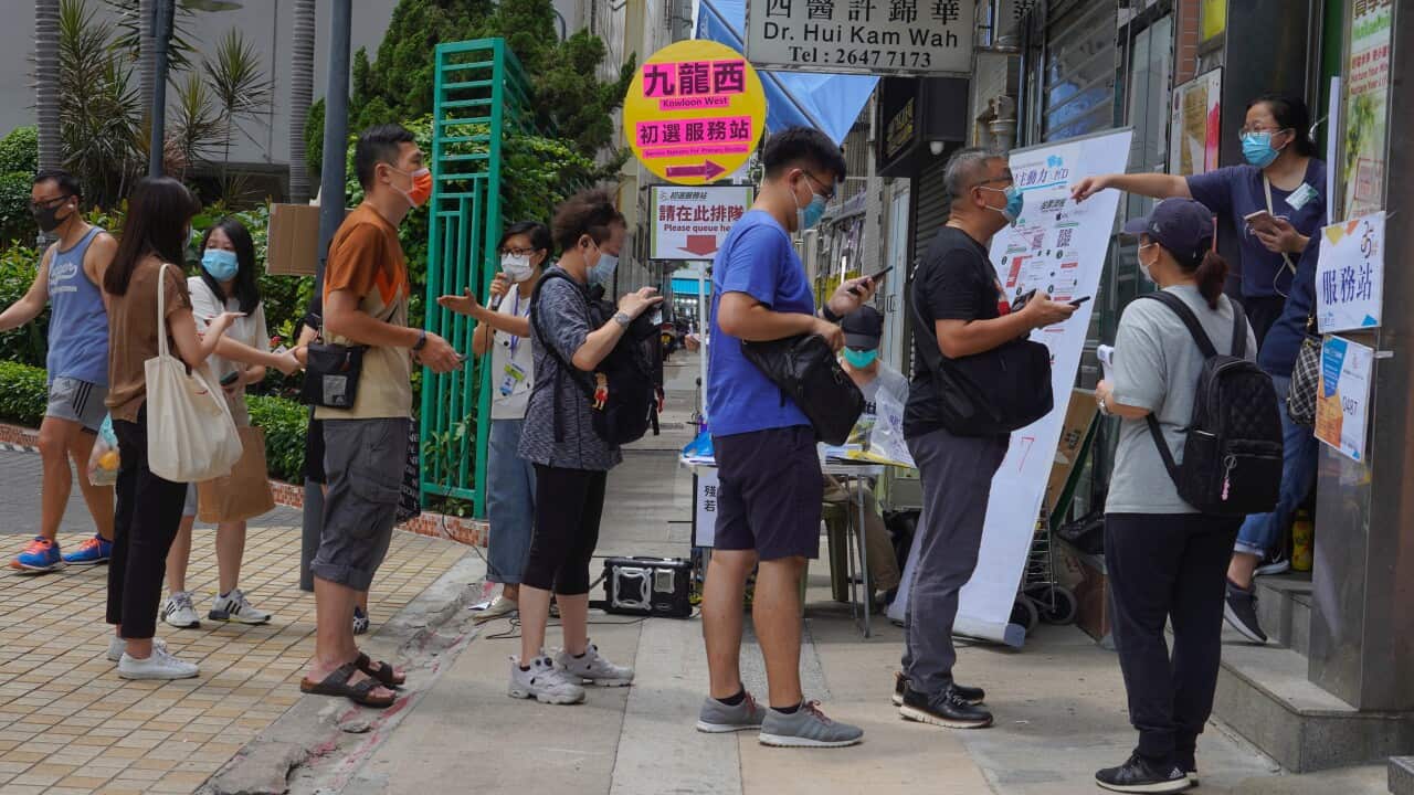 People queue up to vote in Hong Kong in an unofficial primary for pro-democracy candidates ahead of legislative elections in September.