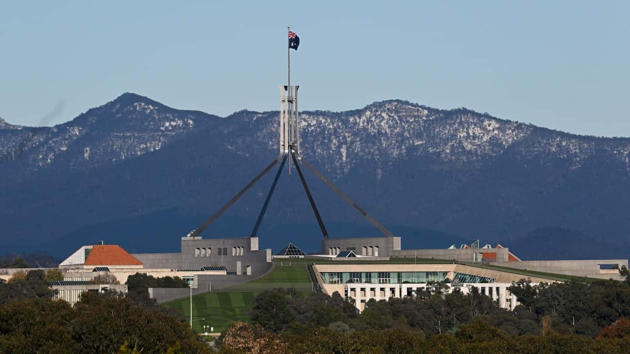Snow covered hills behind Parliament House
