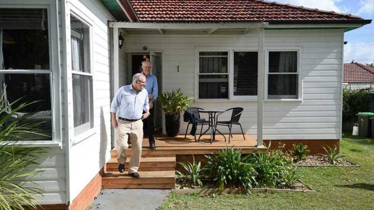 Prime Minister Malcolm Turnbull, along with Treasurer Scott Morrison are seen after meeting with Julian and Kim Mignacca at their home in Penshurst, Sydney.