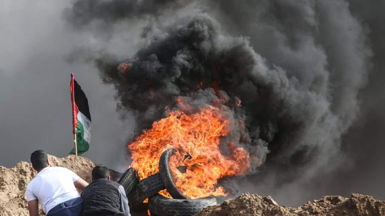 The Great March of Return: Thousands of Palestinians charge border in ...