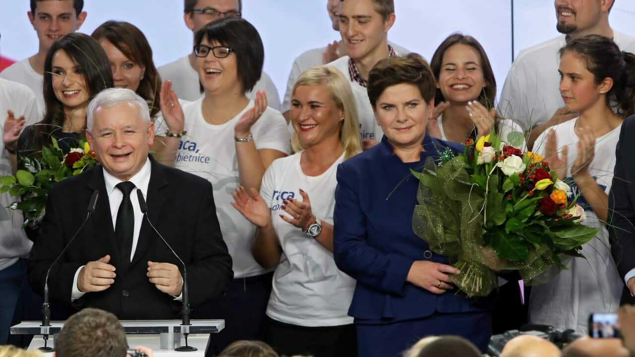 Conservative Law and Justice (PiS) leader Jaroslaw Kaczynski (L) with Law and Justice candidate for the Prime Minister Beata Szydlo (R) react during parliamentary elections night in Warsaw, Poland, 25 October 2015.