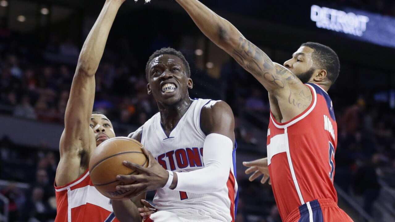 Detroit Pistons guard Reggie Jackson (C)