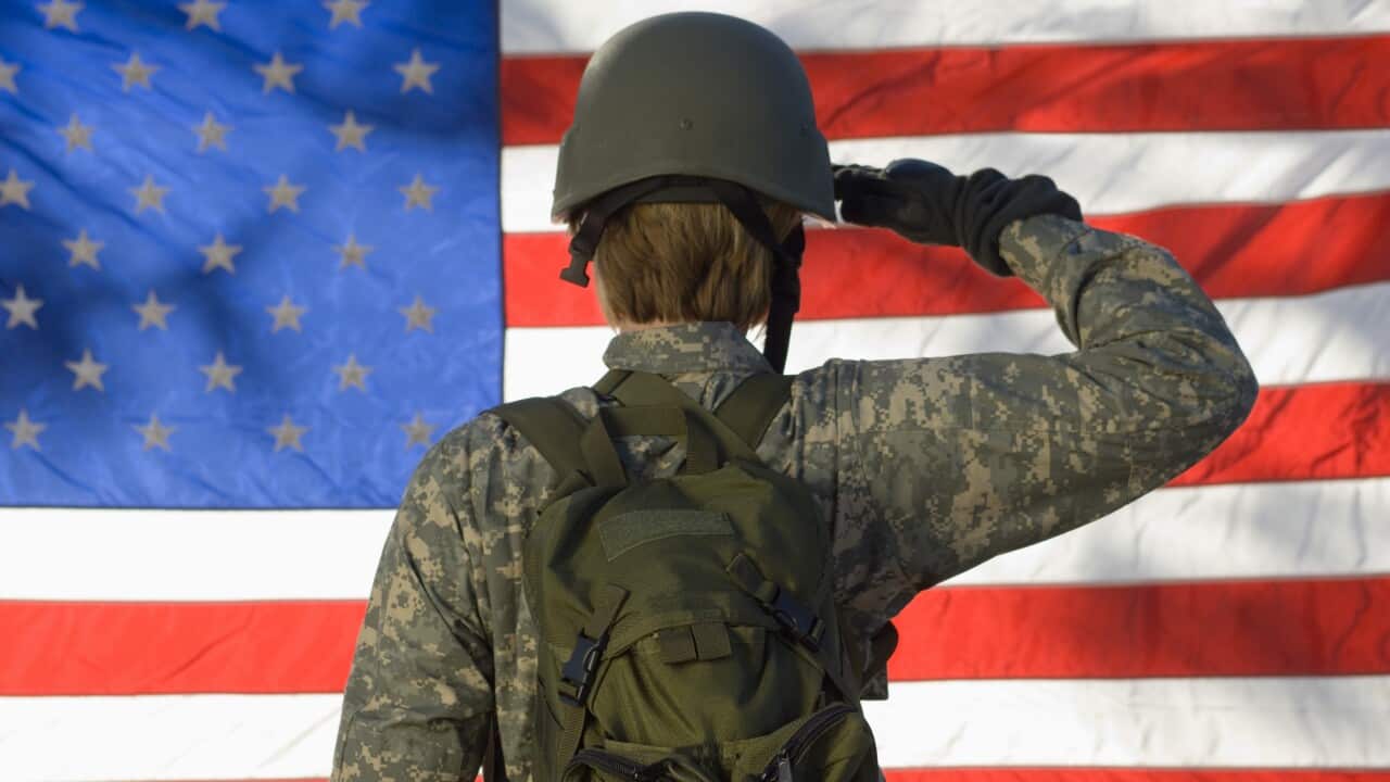 (File Image) A US soldier saluting in front of American flag.