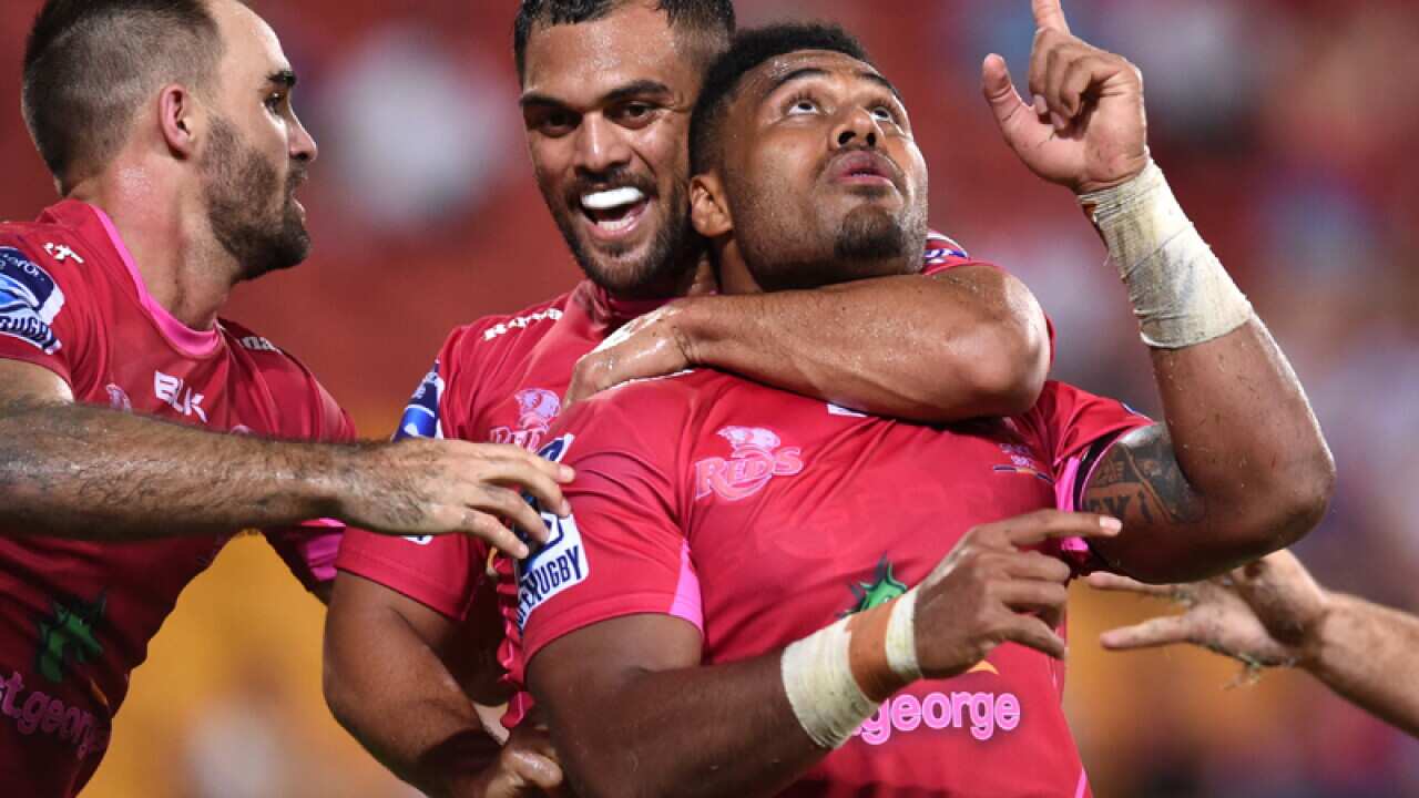 Samu Kerevi of the Queensland Reds celebrates scoring a try