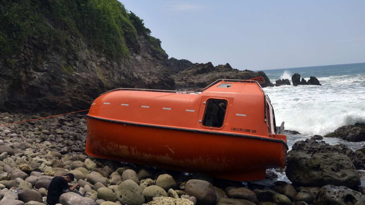 The lifeboat that washed up on central Java's Karangjambe Beach