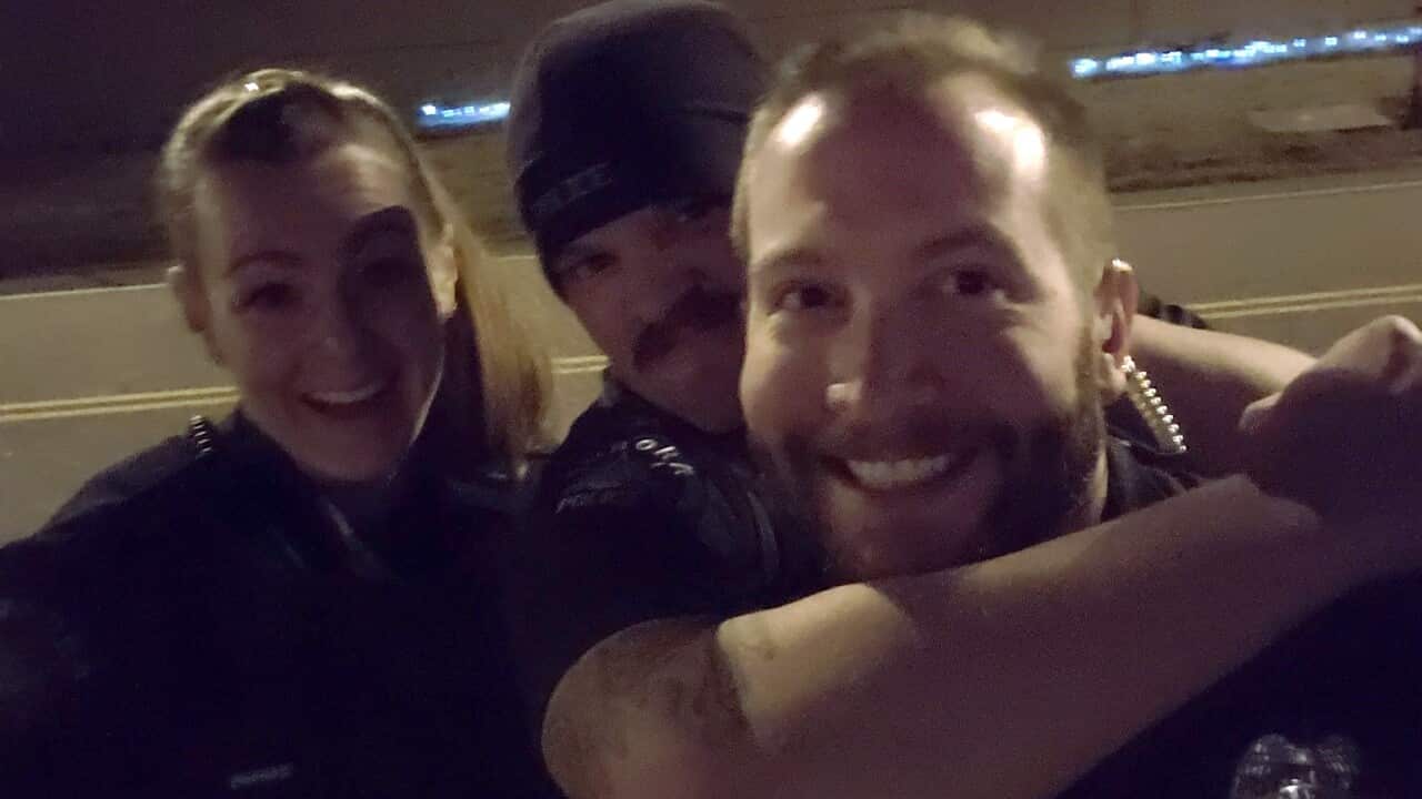 Officers Erica Marrero, Jaron Jones and Kyle Dittrich are pictured re-enacting the chokehold linked to Elijah McClain's death in Colorado.