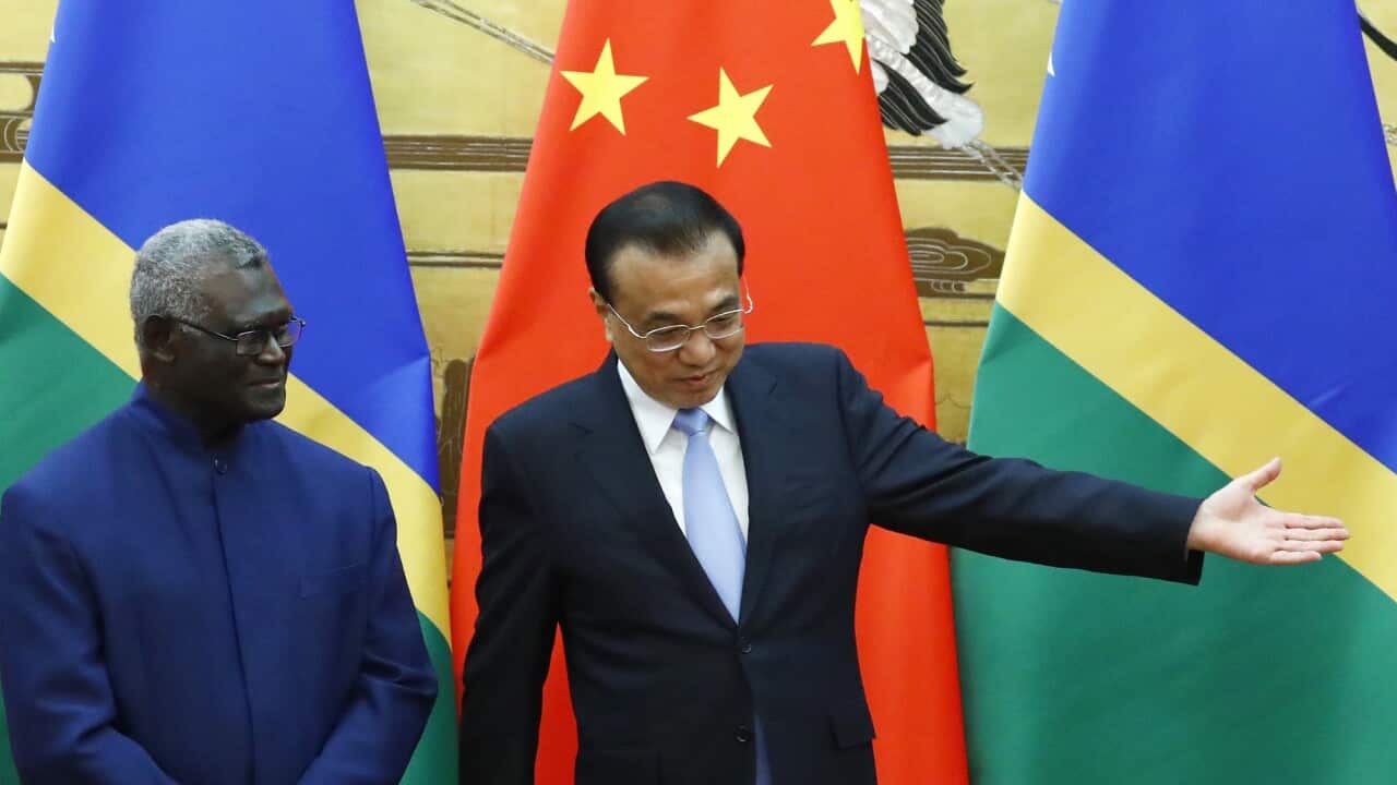 Solomon Islands Prime Minister Manasseh Sogavare (left) and Chinese Premier Li Keqiang.
