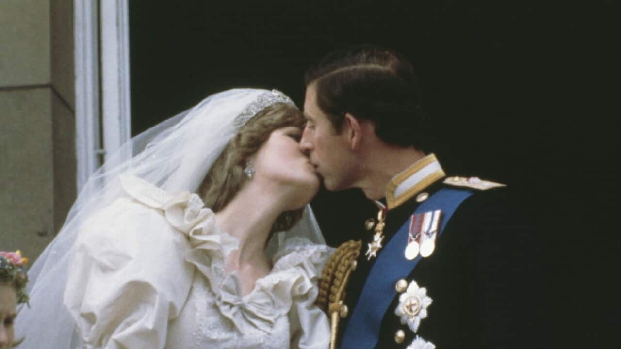 Princess Diana and Prince Charles kiss after their wedding in 1981.