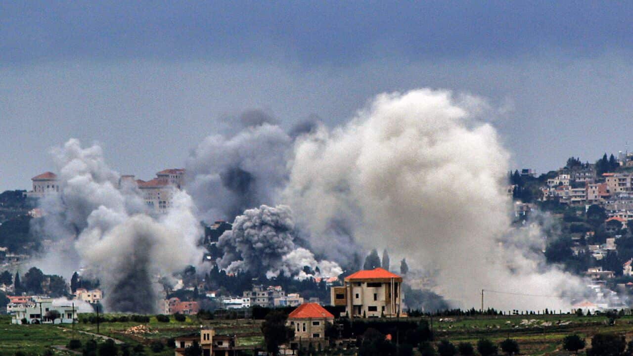 A lebanese village that's been hit by air strikes with smoke billowing