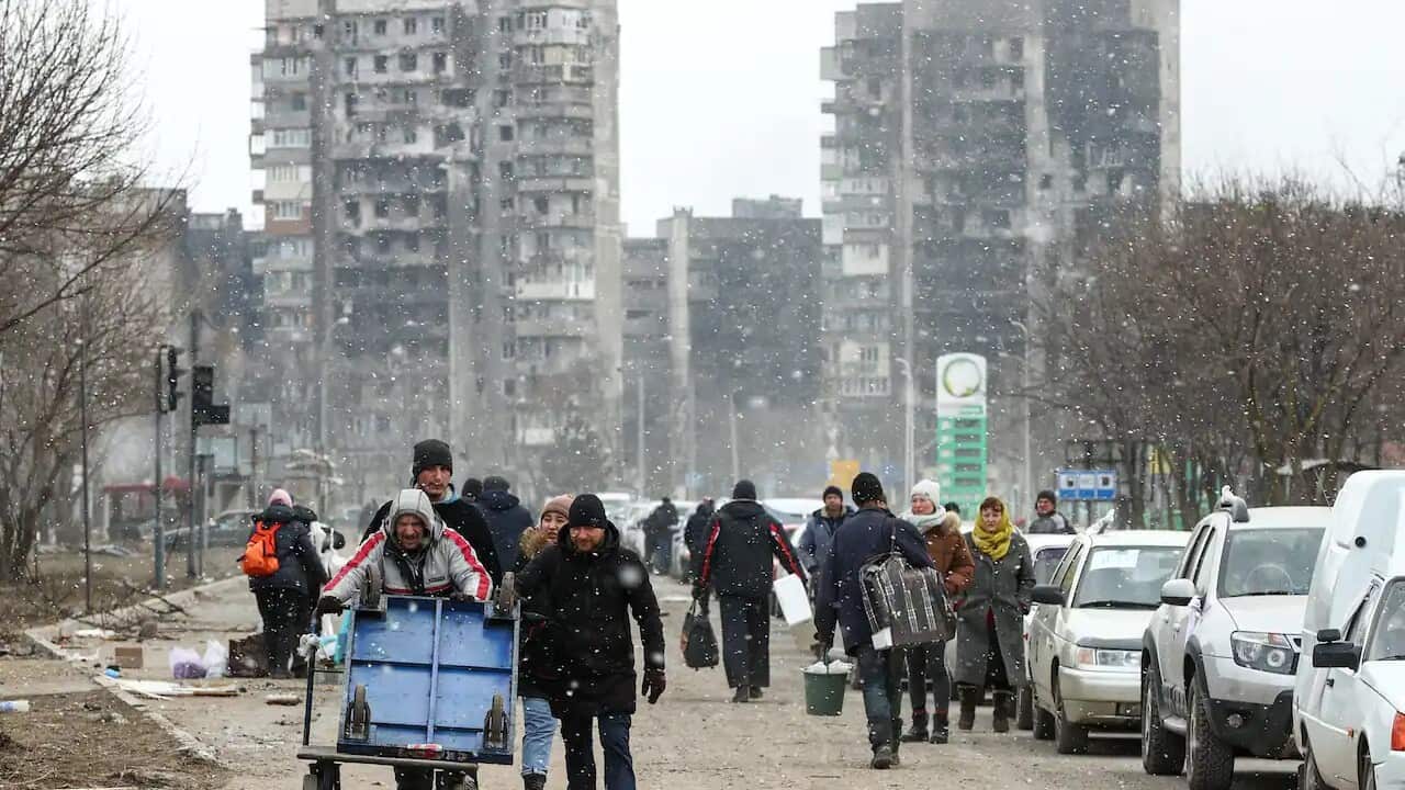 Civilians follow a humanitarian corridor from the besieged city of Mariupol, Ukraine, on 17 March, 2022.