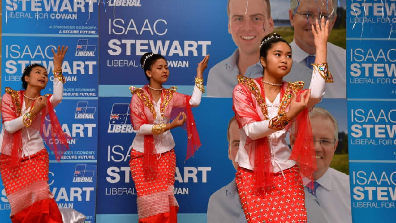 Traditional dancers from Myanmar perform for Scott Morrison and Liberal candidate Isaac Stewart at a multicultural event near Perth (AAP)