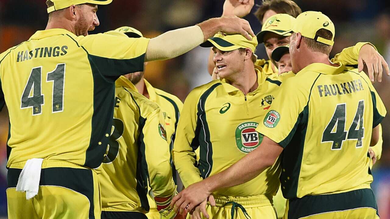 Australia celebrate after their win over India