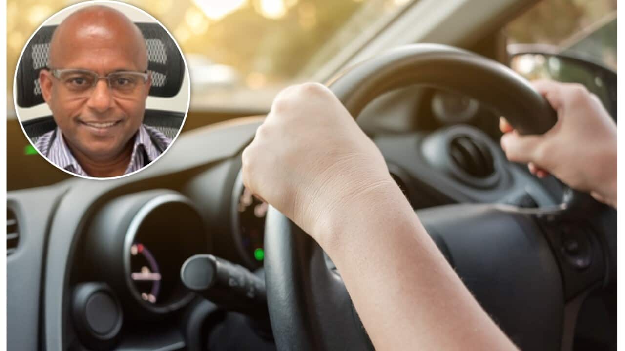 Woman's hands on car steering wheel