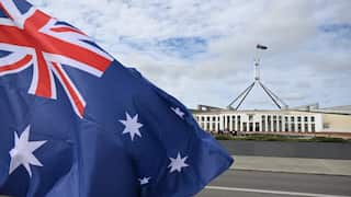 An Australian flag flies outside Parliament House in Canberra.