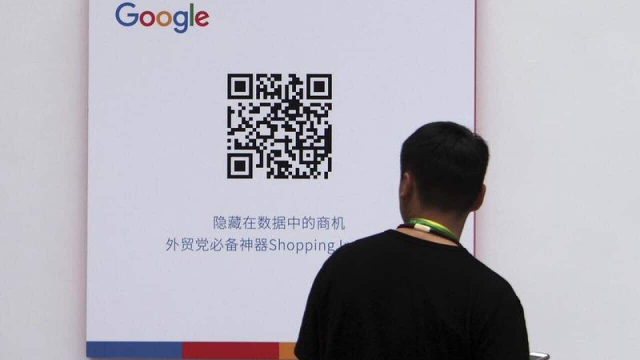 A visitor at a Google stand during an exhibition in China.