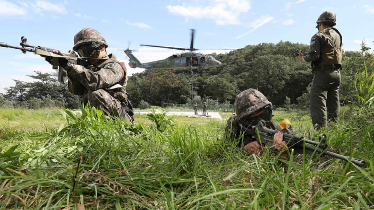 South Korean army soldiers aim their machine guns during the annual Ulchi Freedom Guardian exercise in Yongin, South Korea