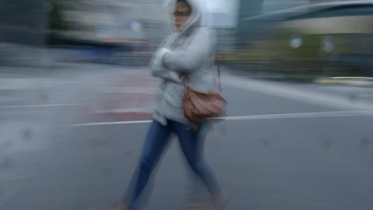 A woman rugs up