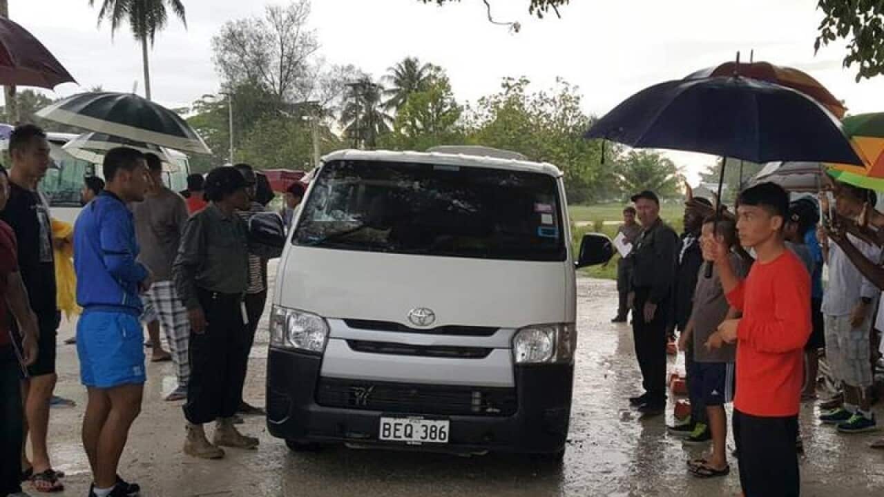 Asylum seekers leaving the Manus Island detention centre.