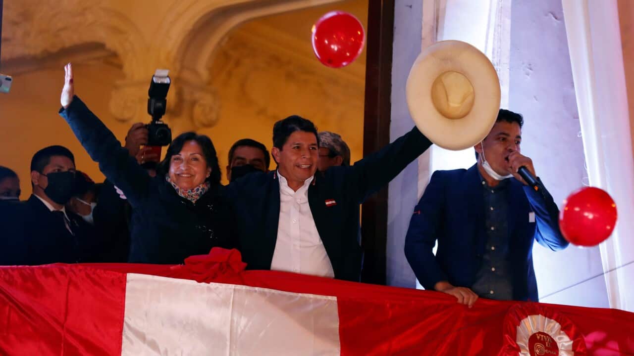 Pedro Castillo greets supporters from a balcony after being proclaimed president-elect of the country, in Lima, Peru, 19 July 2021.
