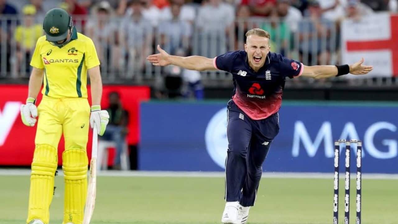 Tom Curran of England celebrates dismissing Adam Zampa.
