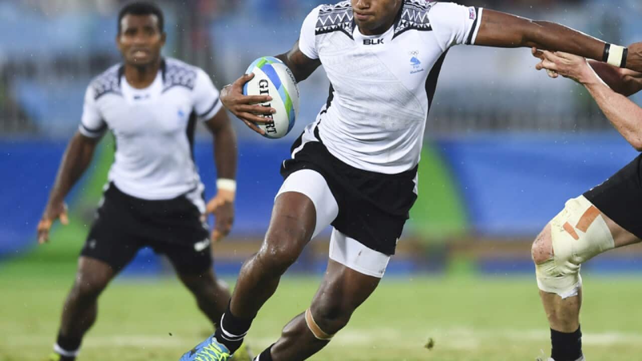 Semi Kunatani of Fiji fights for the ball
